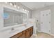 Bathroom featuring double sinks, large mirror, and updated vanity at 4217 Old Brick Ct, Raleigh, NC 27616