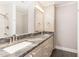 Bathroom featuring a double sink with light grey cabinets and granite countertops at 4322 Russell Rd, Graham, NC 27253
