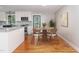 Eat-in kitchen dining area with hardwood floors and natural light at 4322 Russell Rd, Graham, NC 27253