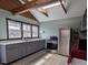 Modern kitchen featuring stainless steel appliances, ample countertop space, and sleek gray cabinetry at 4322 Russell Rd, Graham, NC 27253