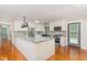 Bright kitchen featuring granite countertops, modern appliances, and ample cabinet space at 4322 Russell Rd, Graham, NC 27253