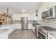 Contemporary kitchen with stainless steel appliances and granite countertops at 4322 Russell Rd, Graham, NC 27253