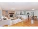 Spacious open-concept living and kitchen area with stone fireplace and hardwood floors at 4322 Russell Rd, Graham, NC 27253