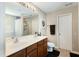 Bathroom features a double sink vanity with a large mirror, and a shower-tub combo at 503 Ganyard Farm Way, Durham, NC 27703