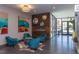 Inviting lobby area with modern seating, wood accent wall with fireplace, and abundant natural light at 515 N Churton St # 208, Hillsborough, NC 27278