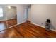 Bedroom with mirrored closet and hardwood floors, offering plenty of closet space at 5420 Golden Moss Trl, Raleigh, NC 27613