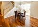 Bright dining area with access to the backyard and an adjacent staircase at 5420 Golden Moss Trl, Raleigh, NC 27613