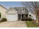 Charming single-Gathering home with a well-maintained lawn and attached single car garage at 5420 Golden Moss Trl, Raleigh, NC 27613