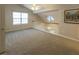 Upstairs hallway with neutral carpet at 5420 Golden Moss Trl, Raleigh, NC 27613