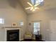 Bright living room includes a fireplace, vaulted ceilings, and ample windows at 5420 Golden Moss Trl, Raleigh, NC 27613