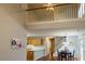Open living area showing kitchen, stairs, and dining area, illuminated by natural light at 5420 Golden Moss Trl, Raleigh, NC 27613