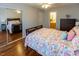 Bright bedroom with a large mirror closet and hardwood flooring, plus ensuite bathroom at 5420 Golden Moss Trl, Raleigh, NC 27613