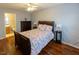 Comfortable main bedroom offering ample space, featuring a ceiling fan and natural light at 5420 Golden Moss Trl, Raleigh, NC 27613