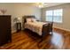 Cozy bedroom showcasing a comfortable bed, ceiling fan, and bright window at 5420 Golden Moss Trl, Raleigh, NC 27613