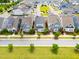 An aerial view showcases a neighborhood's orderly layout of houses along a well-planned street at 5520 Advancing Ave, Raleigh, NC 27616