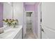 Bright bathroom with a single sink vanity and direct access to the private toilet and shower at 5520 Advancing Ave, Raleigh, NC 27616