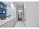 Elegant bathroom showcasing a double sink vanity, a large mirror, and stylish tiled floors at 5520 Advancing Ave, Raleigh, NC 27616