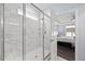 Modern bathroom featuring a glass-enclosed shower with sleek fixtures and tiled walls, next to the main bedroom at 5520 Advancing Ave, Raleigh, NC 27616