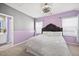 Cozy bedroom with a stylish upholstered headboard, soft carpet, and neutral-toned walls at 5520 Advancing Ave, Raleigh, NC 27616