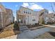 Inviting two-story home boasts a charming front porch and beautifully landscaped front yard at 5520 Advancing Ave, Raleigh, NC 27616