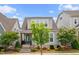 Charming two-story home features an inviting front porch and well maintained landscaping at 5520 Advancing Ave, Raleigh, NC 27616