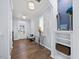 Bright and airy foyer with hardwood floors, storage shelves and coat rack at 5520 Advancing Ave, Raleigh, NC 27616