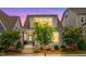 Charming two-story home with landscaped front yard, teal door, and inviting curb appeal at 5520 Advancing Ave, Raleigh, NC 27616