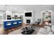 Open concept living room boasts a fireplace, kitchen access and great space to relax or entertain at 5520 Advancing Ave, Raleigh, NC 27616
