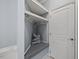 Mud room featuring a built-in bench with storage and coat hooks, complemented by a white door at 5520 Advancing Ave, Raleigh, NC 27616