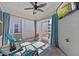 Bright sunroom with tile floors, comfortable seating, and ample natural light, ideal for relaxation and enjoyment at 5520 Advancing Ave, Raleigh, NC 27616