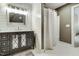 Bathroom featuring modern vanity with chrome fixtures and a walk-in shower at 5708 Creekfall Ln, Fuquay Varina, NC 27526