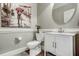 Cozy powder room features elegant wainscoting and a charming art piece at 5708 Creekfall Ln, Fuquay Varina, NC 27526