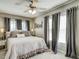 Bedroom featuring a ceiling fan, neutral paint and plenty of natural light at 5708 Creekfall Ln, Fuquay Varina, NC 27526