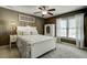 Charming bedroom with a ceiling fan, large window, and neutral paint at 5708 Creekfall Ln, Fuquay Varina, NC 27526