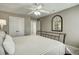 Bedroom featuring neutral walls, ceiling fan and closet access at 5708 Creekfall Ln, Fuquay Varina, NC 27526