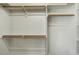 Spacious walk-in closet with custom wood shelving and ample storage space at 5708 Creekfall Ln, Fuquay Varina, NC 27526