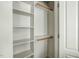 Walk-in closet featuring custom shelving for organization and storage at 5708 Creekfall Ln, Fuquay Varina, NC 27526