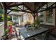 View of the outdoor deck with dining table, chairs, and outdoor decor at 5708 Creekfall Ln, Fuquay Varina, NC 27526