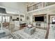 Spacious living room features a custom entertainment center and seamless access to the kitchen at 5708 Creekfall Ln, Fuquay Varina, NC 27526