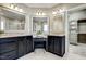 Well-lit main bathroom featuring dual vanities and a built-in makeup counter at 5708 Creekfall Ln, Fuquay Varina, NC 27526