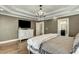 Spacious main bedroom with a decorative tray ceiling and an en-suite bathroom at 5708 Creekfall Ln, Fuquay Varina, NC 27526