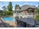 Backyard with a pool area, deck, gazebo, and dining area at 5708 Creekfall Ln, Fuquay Varina, NC 27526