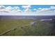 Expansive aerial view showcasing the wooded area, the lakes, and the natural beauty surrounding the community at 59 Riverstone Dr, Pittsboro, NC 27312