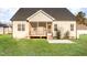 Well-maintained backyard featuring a screened porch, patio, and lush lawn at 60 Pintail Lane Ln, Youngsville, NC 27596