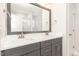 Bathroom featuring double sink vanity with grey cabinets, shower, and tile floors at 60 Pintail Lane Ln, Youngsville, NC 27596