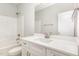 Bright bathroom featuring a white vanity with modern fixtures and a shower-tub combination at 60 Pintail Lane Ln, Youngsville, NC 27596