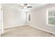 Spacious bedroom with carpet, ceiling fan, and windows offering plenty of natural light at 60 Pintail Lane Ln, Youngsville, NC 27596