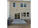 The backyard features new concrete patio perfect for outdoor seating and gatherings at 62 Shay St, Angier, NC 27501