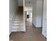 Bright entryway showcasing open stairs leading to the second floor and access to other rooms at 62 Shay St, Angier, NC 27501