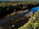 Scenic aerial view of a river surrounded by lush greenery and beautiful rock formations at 64 Shay St, Angier, NC 27501